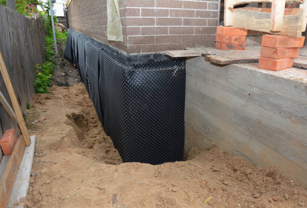 SJ Waterproofing Pros technician performing targeted Sump Pump Installation assessment in Moreland, GA